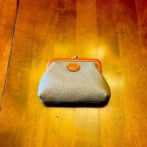 Vintage Dooney and Bourke change purse. Tan with light brown trim.
